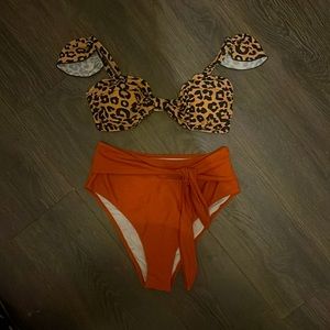 High waisted bikini. Size large but can easily fit a medium. Super cute!!!!